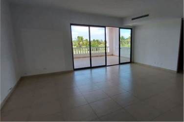 Spacious living room with sliding glass doors open to terrace and garden view at Islamar residence San Carlos Panama