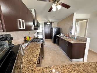 Modern bathroom with granite top, large mirror, tiled shower Royal Palm Playa Gorgona Panama