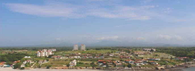 Oceanfront Vista Mar villas with red-tile roofs, pools tropical setting Panama
