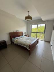 Secondary bedroom with window, tile flooring, minimalist decor at Casco Pacifico Residences Panama