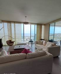 Outdoor dining balcony with sea view, glass railings and ceiling fan in PH Rio Mar Nueva Gorgona Panama