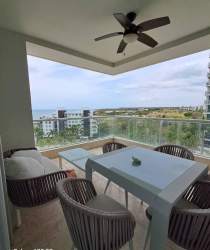 Spacious private balcony with outdoor seating and direct Pacific Ocean views at PH Rio Mar Nueva Gorgona Panama