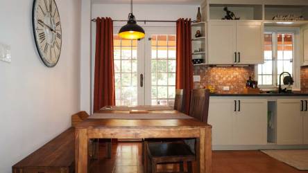 Updated bathroom with patterned shower tiles, vessel sink and wood vanity in beach house Panama