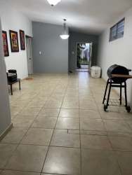 Bedroom with built-in closet pink walls and tile floors in Brisas del Golf Arraiján house