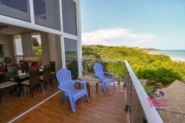 Beachfront balcony at PH Miramar Loft with panoramic ocean and resort pool view Coclé Panama
