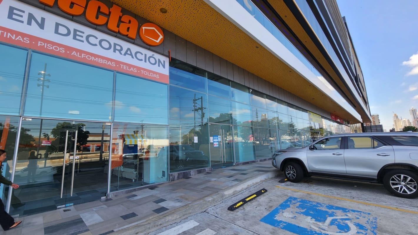 Contemporary commercial building with vertical sunshades and parking at Dorado City Center Panama