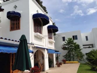 Spacious living and dining area with rustic accents double duplex villa in Playa Blanca Panama