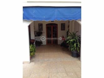 Mediterranean style façade duplex villa with blue accents Playa Blanca Panama