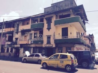 Three-story mixed-use colonial style building corner Avenida Central and Calle 8 Downtown Colón