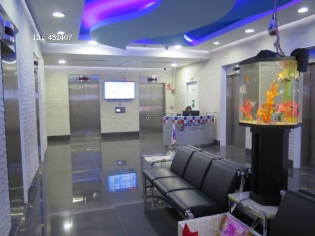 Minimalist interior with white desks and ergonomic chair Oceania Business Plaza Punta Pacifica