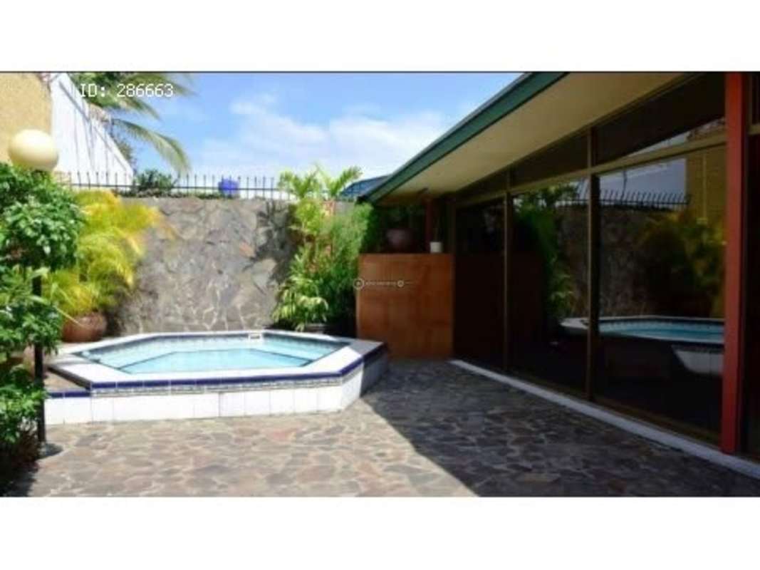 Outdoor terrace with private pool stone deck in family home Altos del Dorado Panama