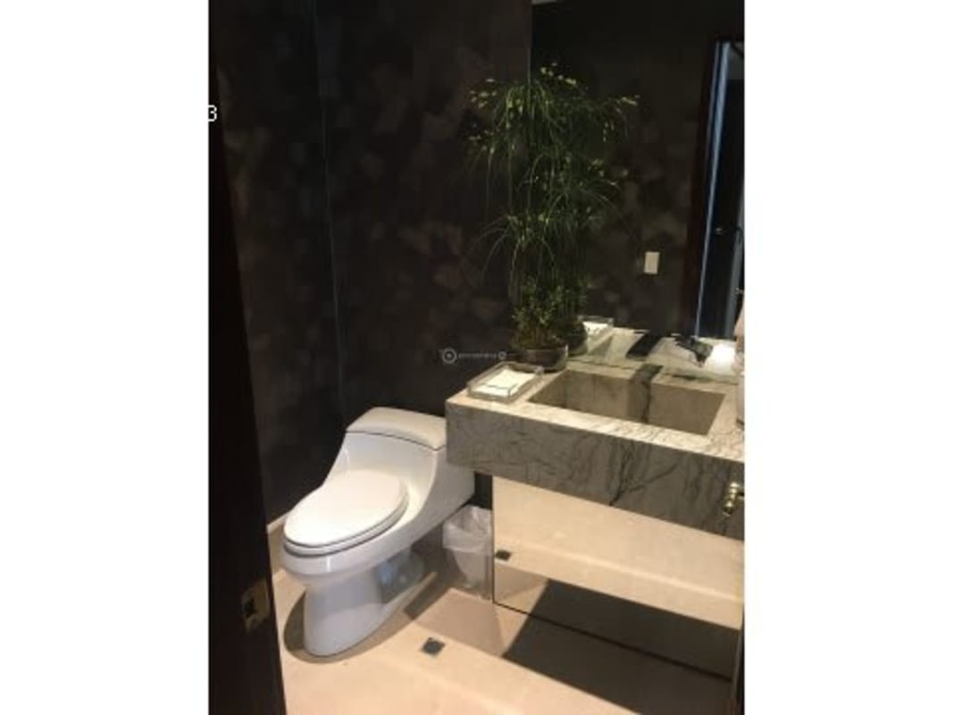 Spacious living room with high ceiling marble floors panoramic windows Altos del Golf Panama luxury home